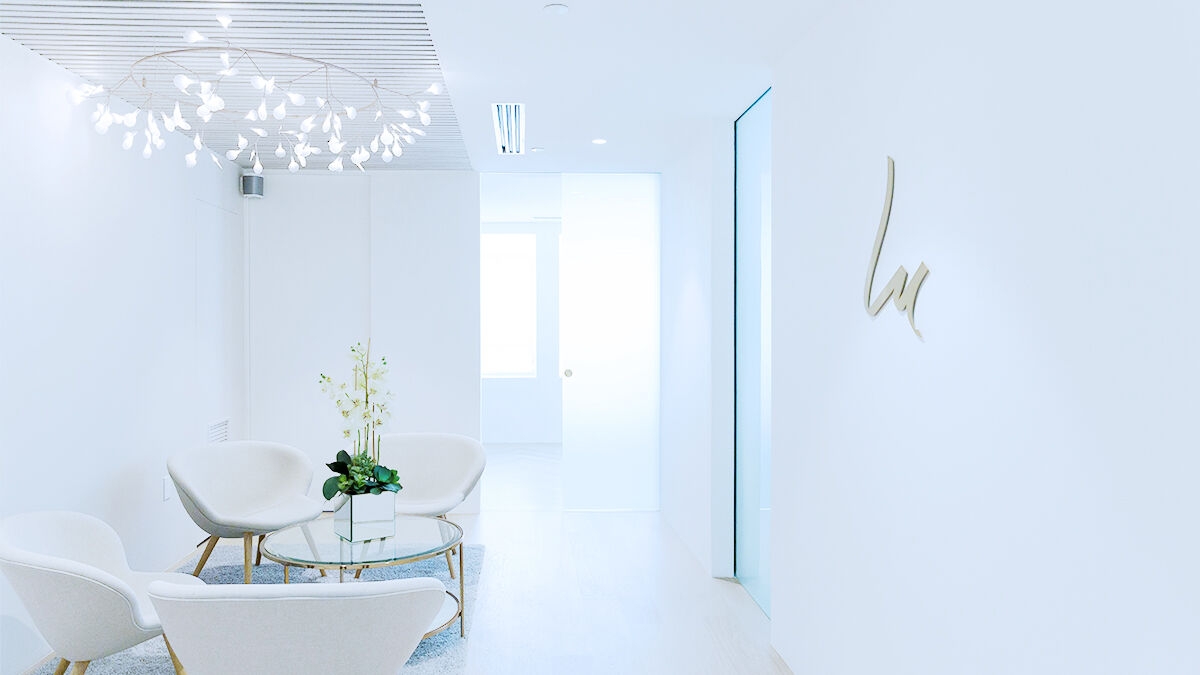 Waiting area with desk and chairs in a dental practice.