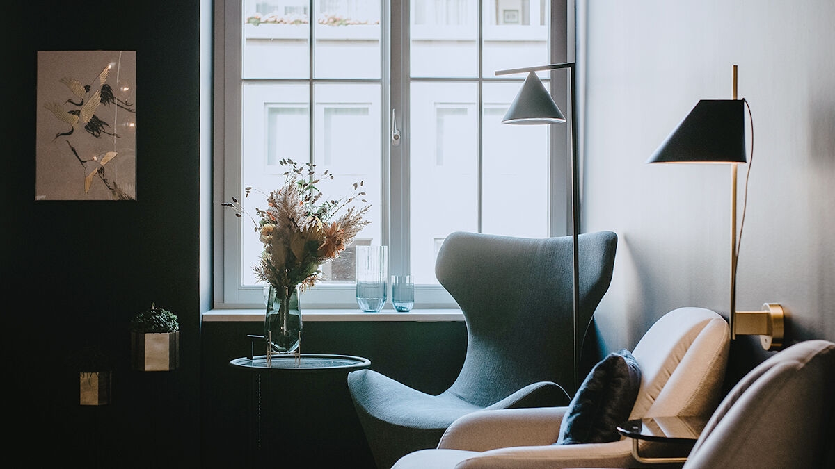 Cozy waiting room with armchairs and small table