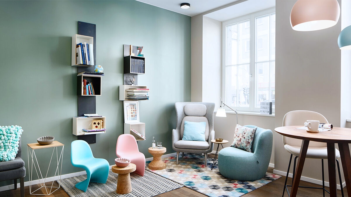 Waiting room with designer furnishings, pastel color tones, and a big picture window.