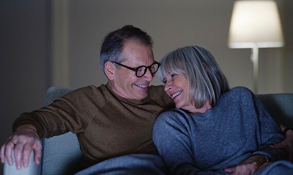 Happy couple in sofa