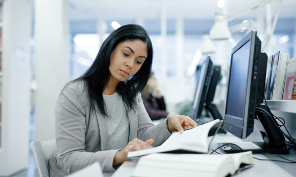 Woman in library reading