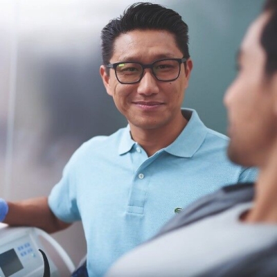 Male dentist with male patient